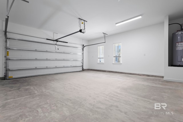 garage featuring a garage door opener, water heater, and baseboards