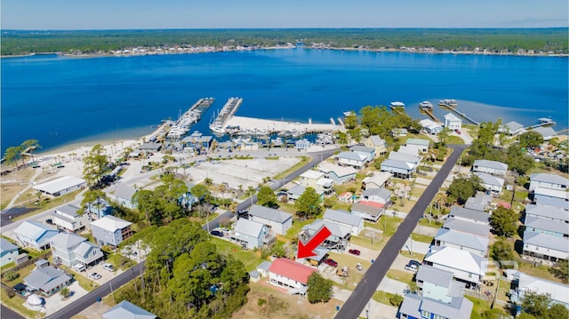 bird's eye view featuring a water view and a residential view