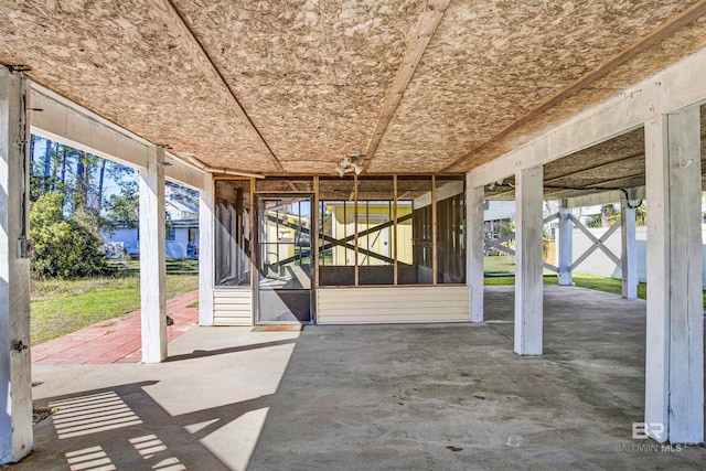 view of patio / terrace featuring a sunroom