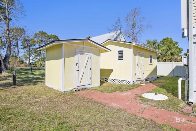 view of shed with fence