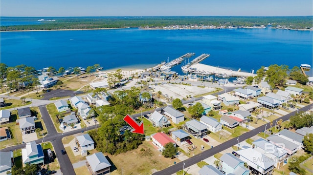 bird's eye view with a water view and a residential view