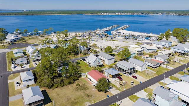 bird's eye view with a water view and a residential view