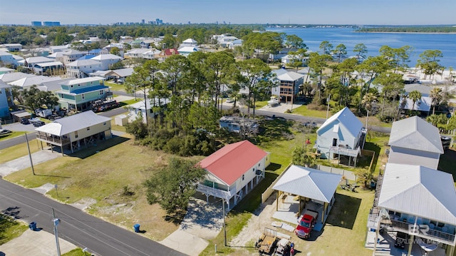 bird's eye view featuring a water view and a residential view