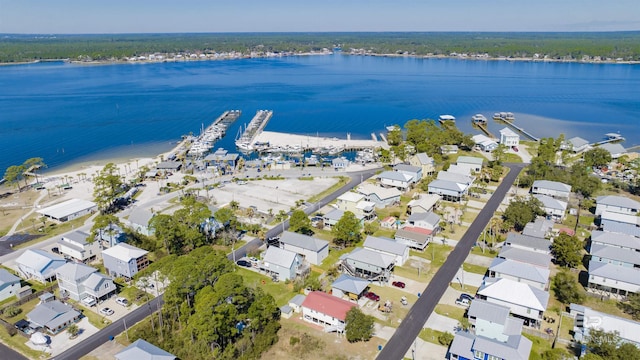 bird's eye view featuring a water view and a residential view