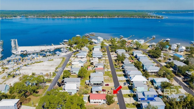 bird's eye view featuring a water view and a residential view