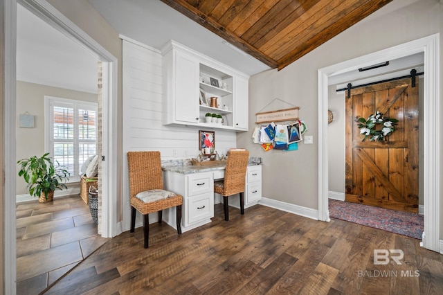 office with built in desk, vaulted ceiling, dark wood-type flooring, and wood ceiling