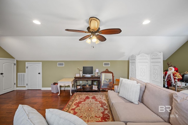 living room featuring dark hardwood / wood-style floors, ceiling fan, and lofted ceiling