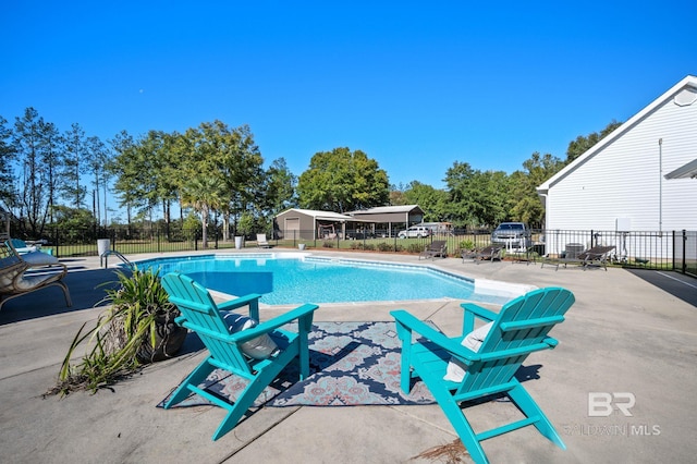 view of swimming pool featuring a patio area