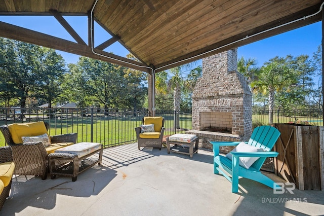 view of patio featuring an outdoor brick fireplace