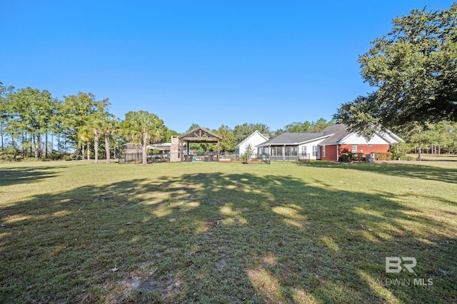 view of yard featuring a sunroom