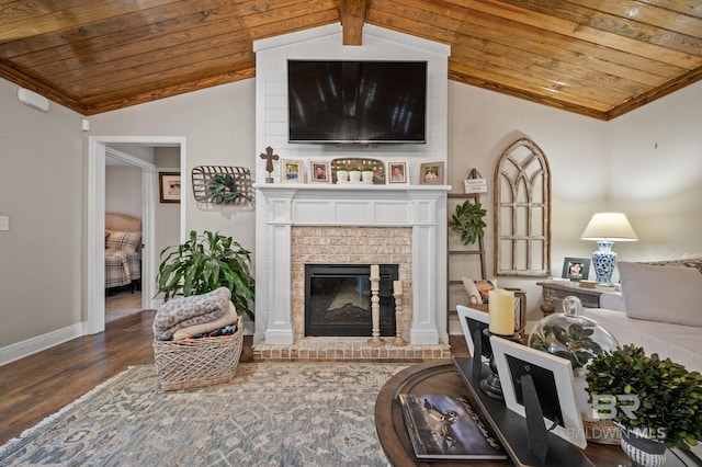 living room featuring lofted ceiling with beams, dark hardwood / wood-style flooring, wooden ceiling, and a fireplace