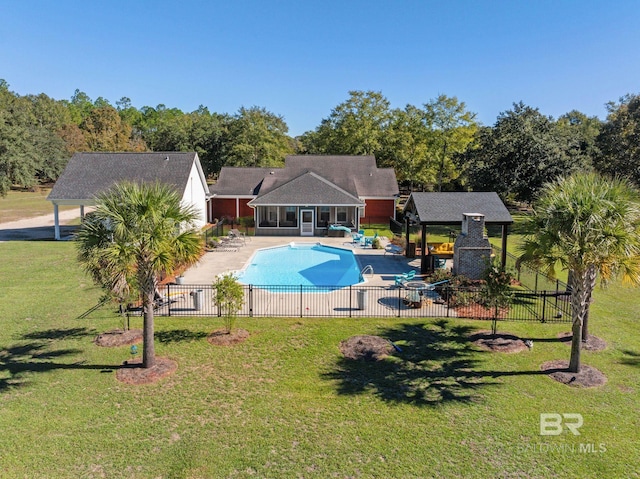 view of swimming pool featuring a sunroom, a gazebo, a yard, and a patio