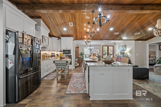 kitchen with wood ceiling, white cabinetry, stainless steel appliances, and hanging light fixtures