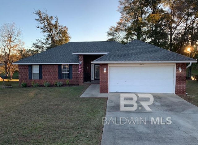 view of front of property with a garage and a front lawn