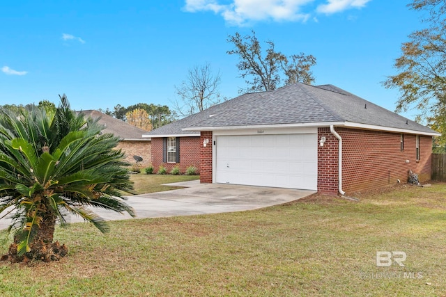 view of side of property with a garage and a lawn