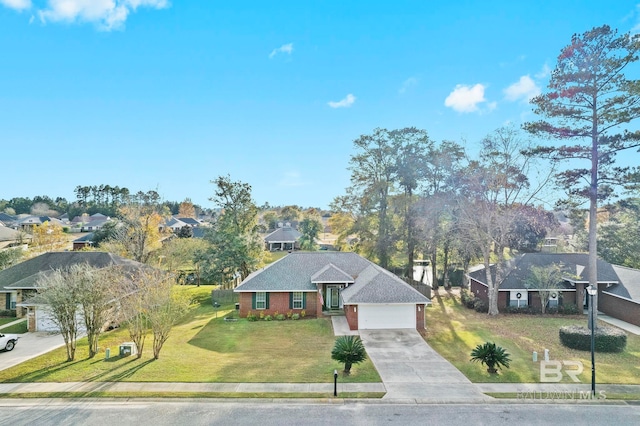 view of front of house with a front yard and a garage