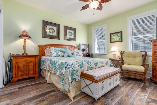 630 Lemoyne Dr Unit 8D, Dauphin Island, AL 36528 - bedroom with dark wood-type flooring and ceiling fan