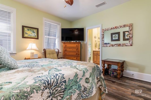 630 Lemoyne Dr Unit 8D, Dauphin Island, AL 36528 - bedroom featuring wood finished floors, baseboards, visible vents, and connected bathroom