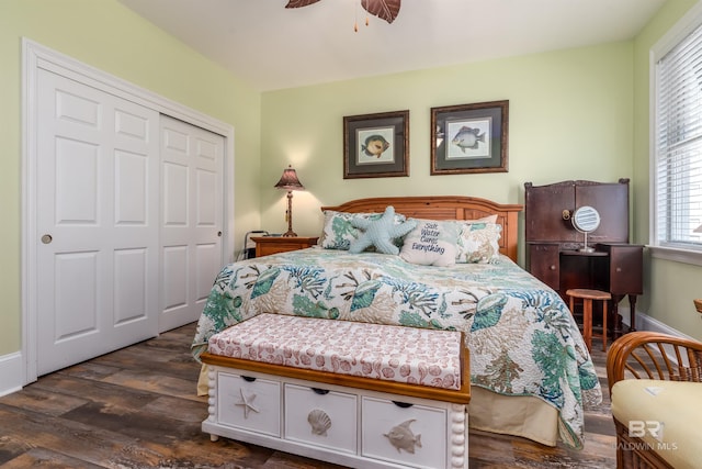 630 Lemoyne Dr Unit 8D, Dauphin Island, AL 36528 - bedroom featuring a closet, baseboards, ceiling fan, and dark wood finished floors