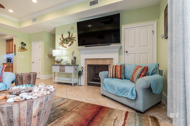 630 Lemoyne Dr Unit 8D, Dauphin Island, AL 36528 - living room featuring visible vents, light tile patterned floors, a tiled fireplace, ornamental molding, and recessed lighting