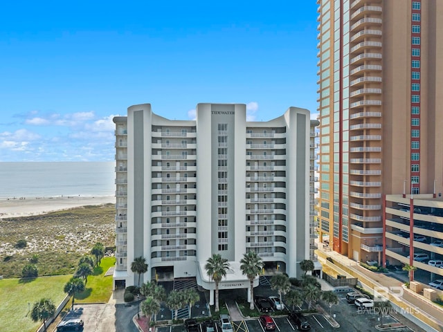 view of property featuring a water view and a view of the beach