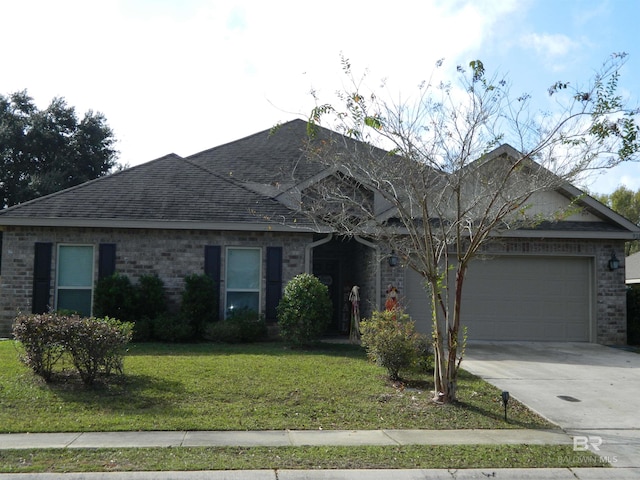 ranch-style house featuring a garage and a front lawn