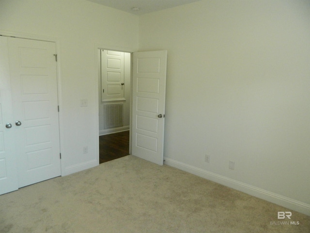 unfurnished bedroom with carpet