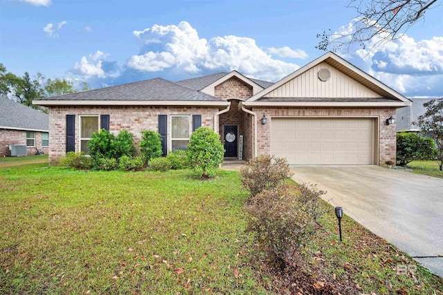 view of front of property featuring a garage, a front lawn, and cooling unit