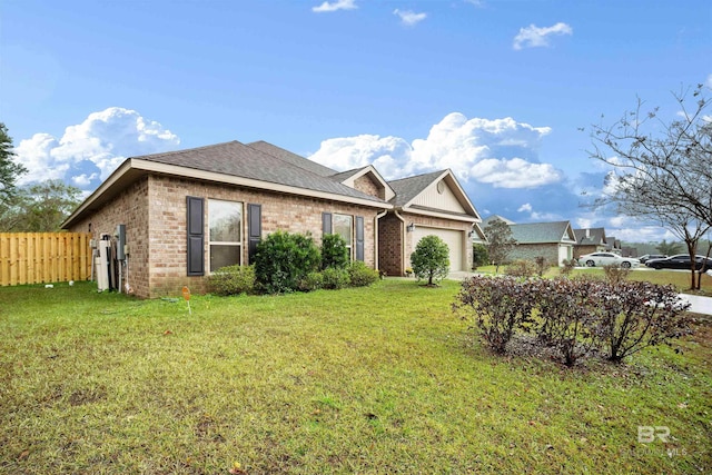 ranch-style house with a garage and a front lawn