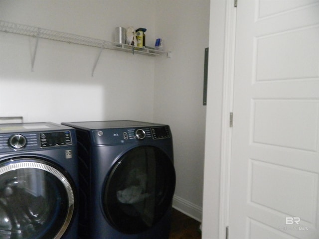 laundry area with washing machine and clothes dryer