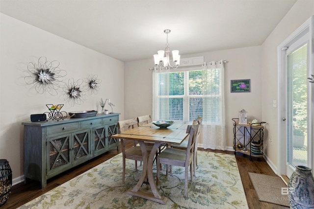17741 Lewis Smith Dr, Foley, AL 36535 - dining room with dark wood-style flooring, a chandelier, and plenty of natural light