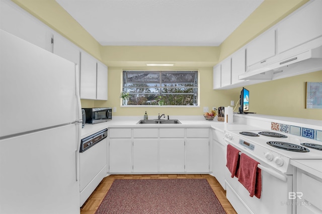 2277 Oyster Bay Ln Unit 502, Gulf Shores, AL 36542 - kitchen featuring white appliances, white cabinetry, under cabinet range hood, light countertops, and a sink