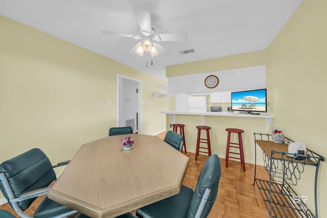 2277 Oyster Bay Ln Unit 502, Gulf Shores, AL 36542 - dining room featuring ceiling fan, baseboards, and visible vents