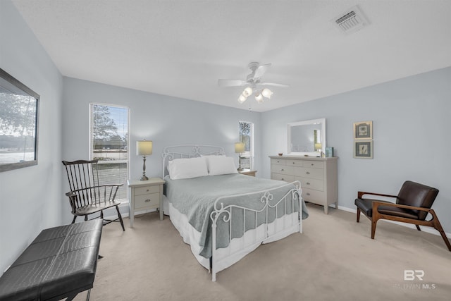 2277 Oyster Bay Ln Unit 502, Gulf Shores, AL 36542 - bedroom featuring light carpet, visible vents, baseboards, and ceiling fan