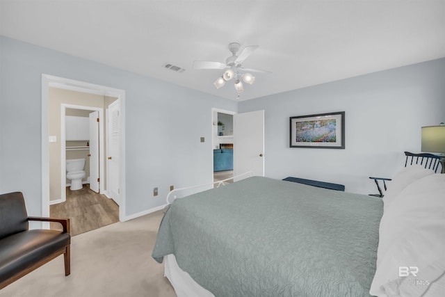 2277 Oyster Bay Ln Unit 502, Gulf Shores, AL 36542 - bedroom with baseboards, a ceiling fan, visible vents, and connected bathroom