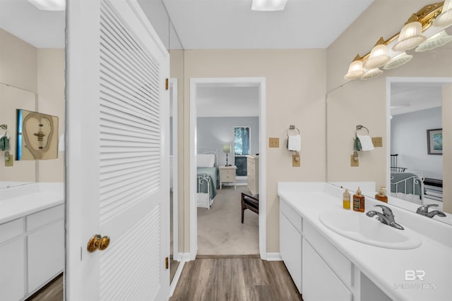 2277 Oyster Bay Ln Unit 502, Gulf Shores, AL 36542 - bathroom featuring wood finished floors, vanity, and baseboards