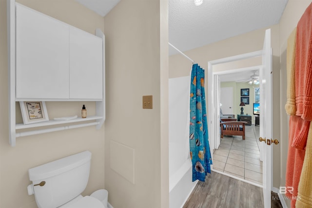 2277 Oyster Bay Ln Unit 502, Gulf Shores, AL 36542 - bathroom with toilet, ceiling fan, wood finished floors, and a textured ceiling