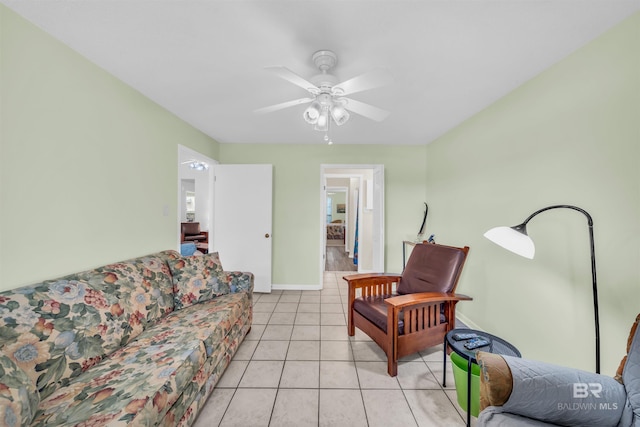 2277 Oyster Bay Ln Unit 502, Gulf Shores, AL 36542 - living area with light tile patterned floors, ceiling fan, and baseboards