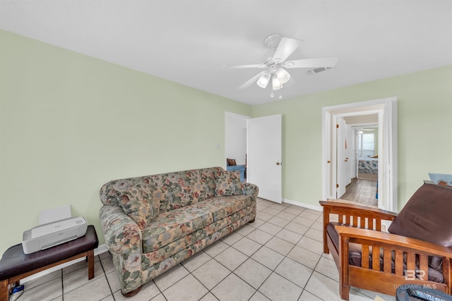 2277 Oyster Bay Ln Unit 502, Gulf Shores, AL 36542 - living area with visible vents, baseboards, a ceiling fan, and light tile patterned flooring