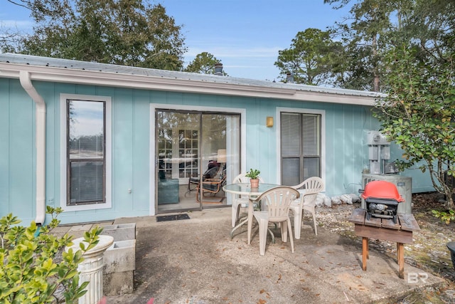 2277 Oyster Bay Ln Unit 502, Gulf Shores, AL 36542 - rear view of property featuring a patio and metal roof
