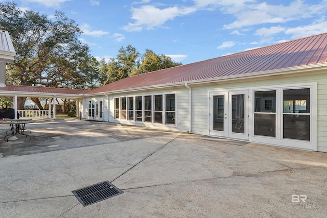 2277 Oyster Bay Ln Unit 502, Gulf Shores, AL 36542 - back of house featuring french doors, a patio area, and metal roof