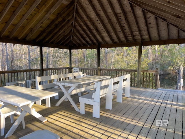 2277 Oyster Bay Ln Unit 502, Gulf Shores, AL 36542 - deck with outdoor dining space and a wooded view