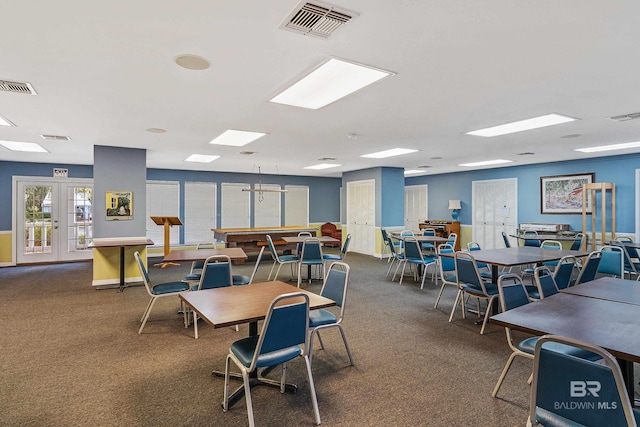 2277 Oyster Bay Ln Unit 502, Gulf Shores, AL 36542 - dining space with french doors, visible vents, and carpet floors