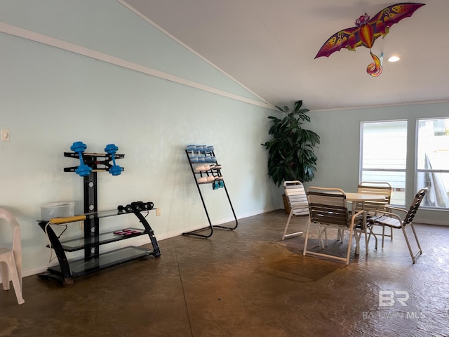 2277 Oyster Bay Ln Unit 502, Gulf Shores, AL 36542 - dining room with baseboards, vaulted ceiling, concrete flooring, and ornamental molding