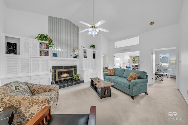 2277 Oyster Bay Ln Unit 502, Gulf Shores, AL 36542 - carpeted living area with high vaulted ceiling, a fireplace, baseboards, and a ceiling fan