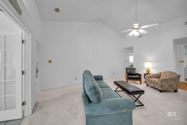2277 Oyster Bay Ln Unit 502, Gulf Shores, AL 36542 - living area with light colored carpet, a ceiling fan, visible vents, vaulted ceiling, and baseboards