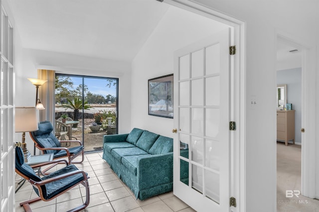 2277 Oyster Bay Ln Unit 502, Gulf Shores, AL 36542 - sitting room featuring light tile patterned floors and lofted ceiling