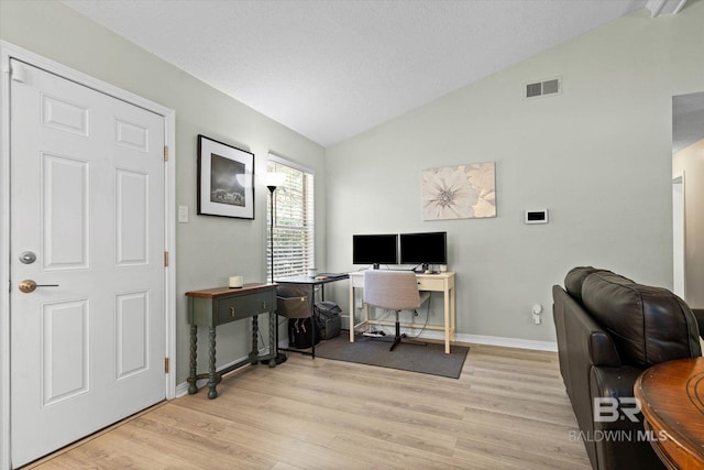 9340 Burnt Tree Dr, Mobile, AL 36695 - office area featuring vaulted ceiling, light wood finished floors, baseboards, and a textured ceiling