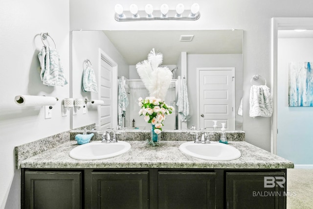 bathroom featuring vanity and walk in shower