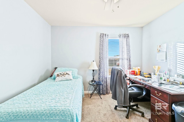 bedroom with ceiling fan and light carpet